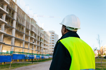 Construction manager inspecting the building's development