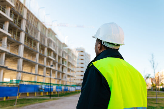 Construction manager inspecting the building's development