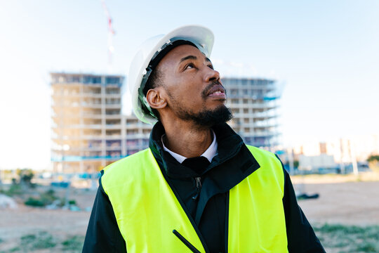Construction manager inspecting the development of the building