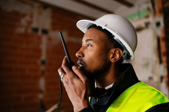 Site manager talking with a walkie talkie