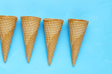 Waffle cones on blue background