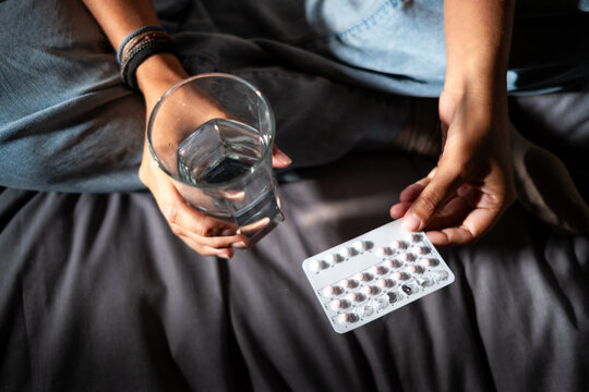 woman taking birth control pills