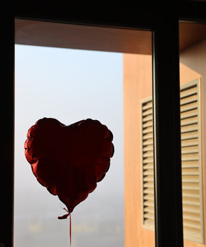 Heart Balloon by Window