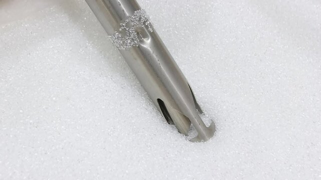 Close view of plastic grains automatically pulled for EVA films