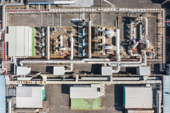 Aerial View of Complex Pipe Network on Industrial Factory Roof