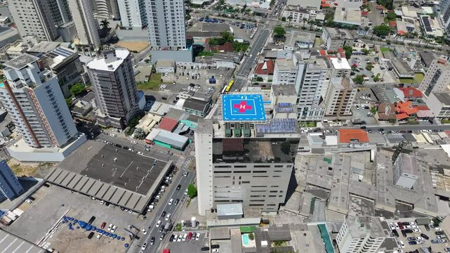 A drone shot capturing the aerial view of Hospital Marieta in Itaja&iacute;, State of Santa Catarina, Brazil, with a clear view of the helipad and surrounding buildings.
