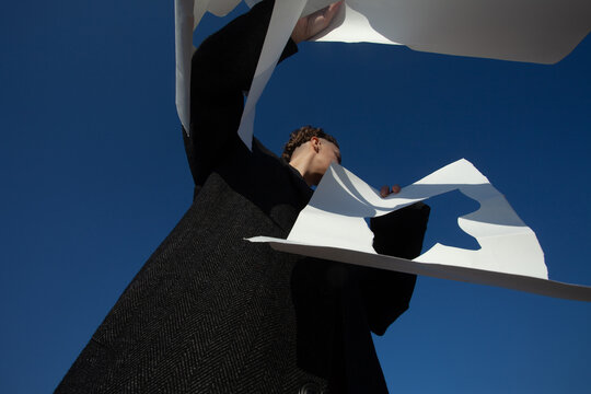 A woman with the white paper 