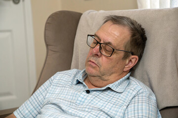 Obraz premium Tired, middle-aged man with headache, eyestrain, and stiff shoulders. Fatigue, exhaustion. Full body wounds.