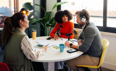 Group podcast discussion in modern office setting