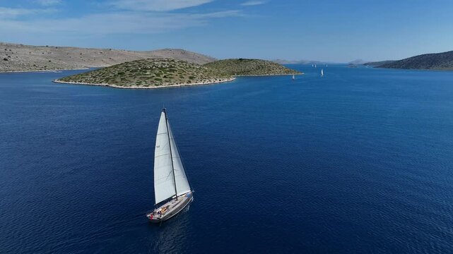 Sailboat Sailing In The Mediterranean Sea In Kornati, Croatia. - aerial shot
