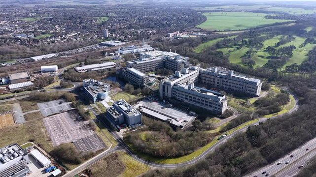 GSK aerial view over Stevenage industrial biopharma factory surrounded by vast British countryside