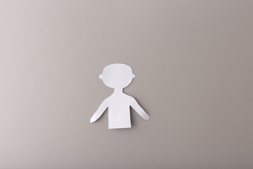 A cut-out silhouette of a person made from white paper , step in creative process, Ideal for art...