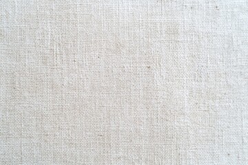 Fototapeta premium White canvas surface texture with cardboard backdrop perfect for packaging, crafts, and design projects in home decor, ideal for artists and creative enthusiasts alike