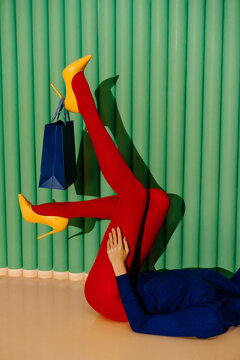 Fashionable woman with red tights and yellow heels