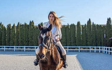 Woman in old money style with a horse. Quiet lifestyle. Lady have a time for riding. Horses concept