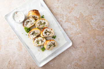 Homemade omelette roulade with chicken