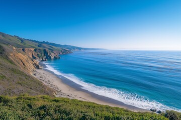 Fototapeta premium Beautiful coastline views, steep cliffs and sandy beaches, water clear blue, waves gently lapping the shore