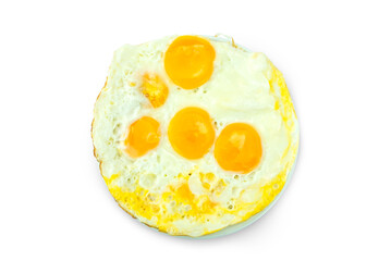 Group of fried eggs with small oil in frying pan, egg whites are set and yolk sunny side up, in a white dish isolated on white background with clipping path top view flat lay stack