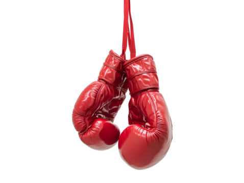 pair of red boxing gloves hanging in mid air, showcasing their shiny texture and vibrant color. Perfect for sports enthusiasts and boxing fans
