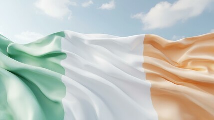 Obraz premium Waving Irish flag under a blue sky, symbolizing national pride and heritage.