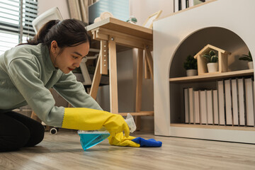 a company's cleaning lady is diligently cleaning the executive's office, the housewife is cleaning the house, the wife is cleaning the house while waiting for her husband to com back form work