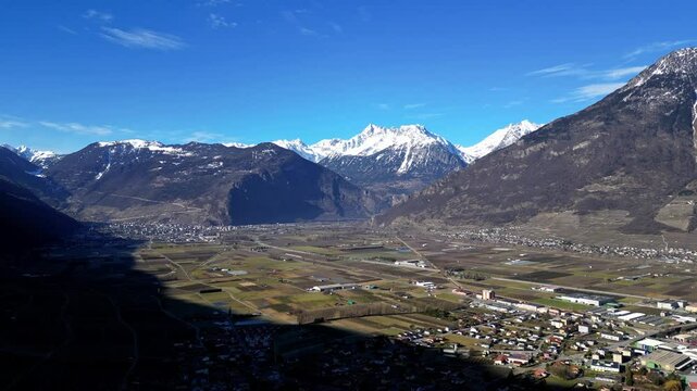 Panoramic View of Martigny and Charrat , with snow-capped mountains in the Swiss Alps