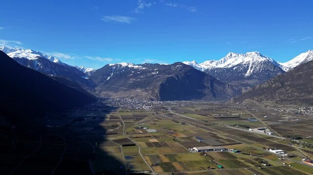 Panoramic View of Martigny and Charrat , with snow-capped mountains in the Swiss Alps