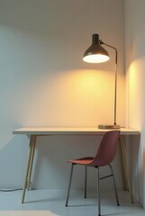 A simple workspace featuring a minimalist desk, a modern chair, and a stylish desk lamp casting a warm glow