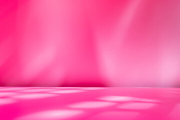 Empty table on bright pink wall background. Composition with abstract shadow on the wall and pink table. Mock up for presentation, branding products, cosmetics, food or jewelry.	
