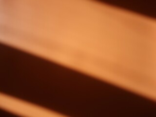 Abstract colorful background with stripes. Orange background with shadow stripes