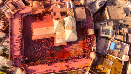 ariel view of villagers playing holi happily , barsane holi view