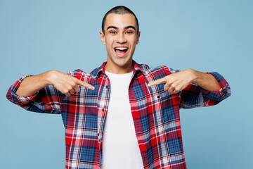 Young winner excited middle eastern man wear red shirt casual clothes point index finger on himself...