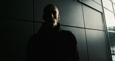 A captivating silhouette emerges against a dark background, evoking curiosity and intrigue