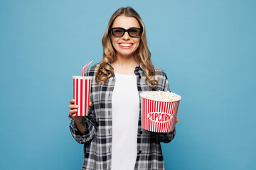 Young woman wears checkered grey shirt casual clothes 3d glasses watch movie film hold bucket of...