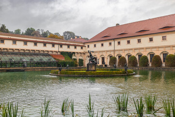 Obraz premium Waldstein Garden and baroque Wallenstein Palace that houses the Senate of the Czech Republic, in Mala Strana, Prague High quality photo