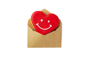 Red heart shape cookie in kraft envelope isolated on white background