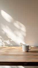 Morning Coffee on Wooden Table: A simple ceramic cup of coffee sits on a wooden table, casting shadows from the sunlight