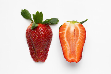 fresh whole and sliced juicy red strawberry on white background