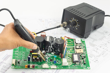 Repairing a circuit board with soldering tools for SMD components
