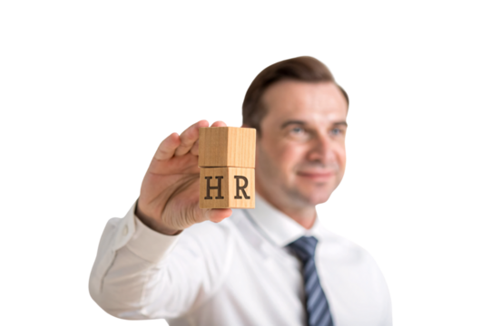 A professional in a white shirt and tie, confidently holding two stacked wooden blocks marked “HR,” symbolizing human resources, leadership, or corporate management, isolated on transparent background