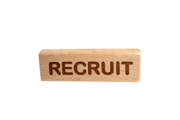 A wooden rectangular block features the word RECRUIT engraved in bold, capital letters. The natural wood grain enhances the text’s prominence, isolated on a transparent background