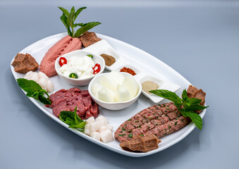 Traditional Lebanese Dish Made Of Raw Meat Called Kibbeh with Garlic paste