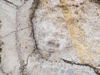 Weathered stone wall texture with cracked cement details