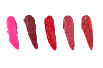 Lipstick range of shades texture composition isolated on white background. Cosmetic product smear smudge swatch sample