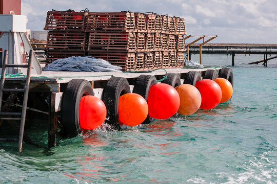 Horizontal shot of commercial cray fishing equipment on a jetty