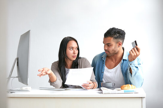 A young couple discussing credit card debt