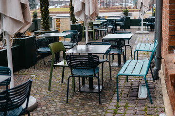 Outdoor cafe seating with tables and chairs