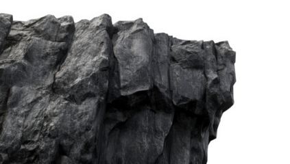 a close-up view of a rugged dark rock formation showcasing intricate textures and sharp edges against a plain white background emphasizing natural geological features