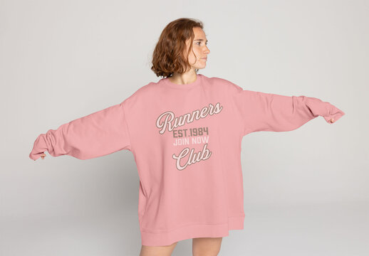 Redhead Woman in Oversized Jumper Poses Confidently Facing Front