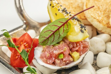 Raw Tuna tartar with avocado and sauce, Food recipe background. Close up. top view